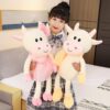 Animal en peluche vache avec jupe