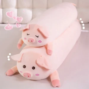 Coussin long en peluche rose en forme de cochon